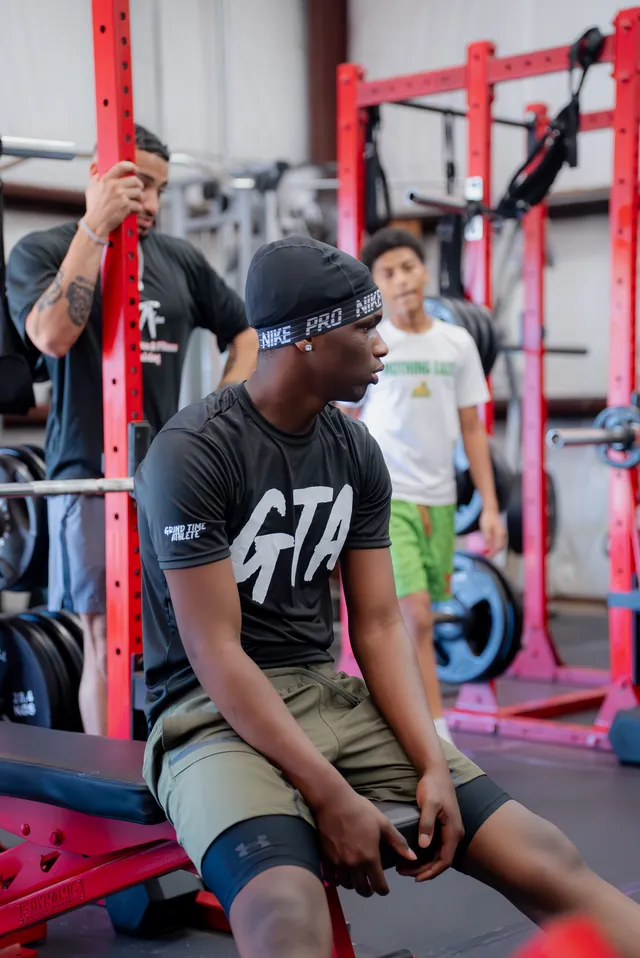Athlete catching his breath between sets
