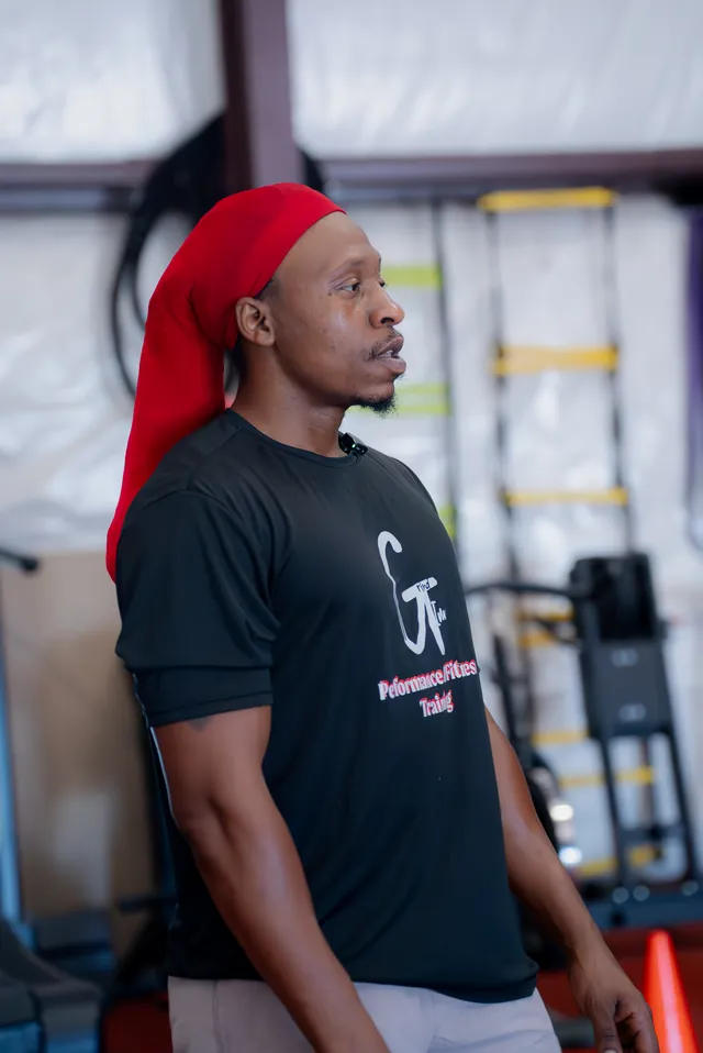 Grind Time coach watching athletes move through a session
